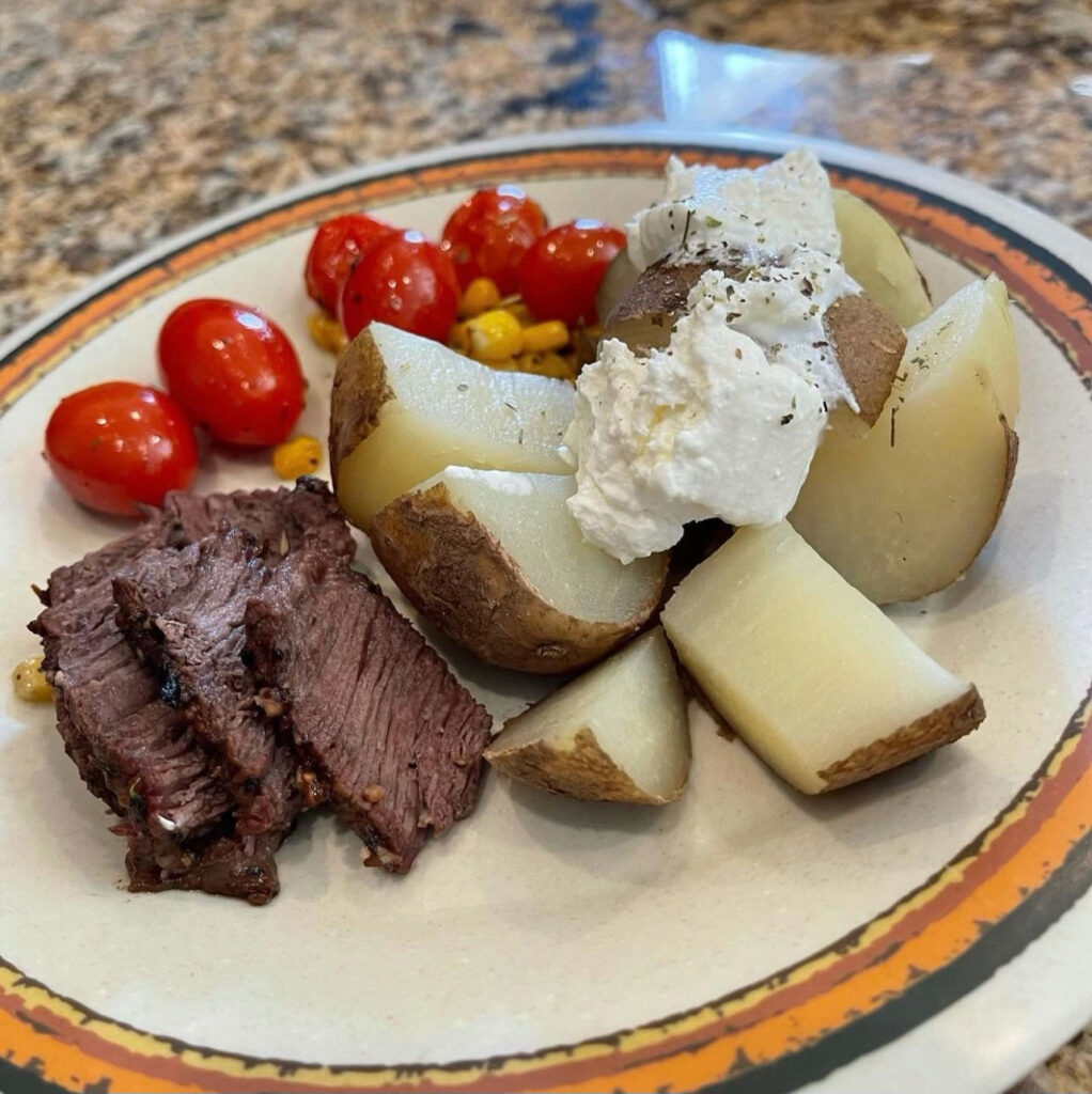 Steak, potatoes and tomatoes dinner