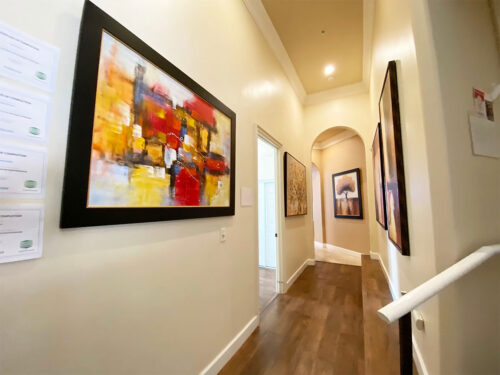 Hallway with artwork on the walls