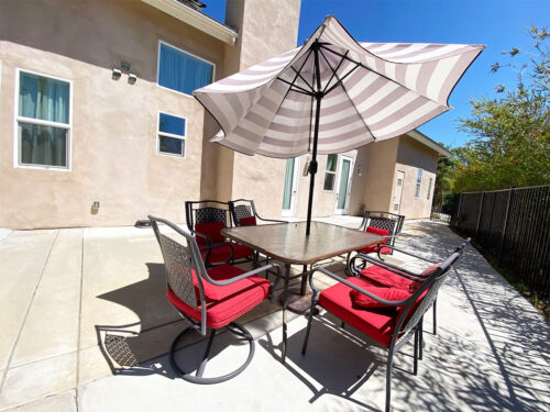 Patio with table, chairs and sun umbrella