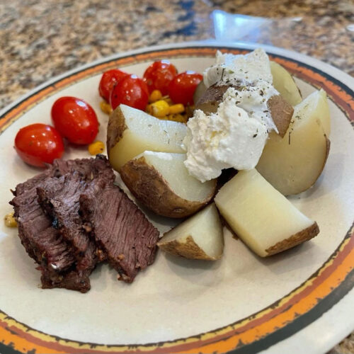 Steak, potatoes and tomatoes dinner