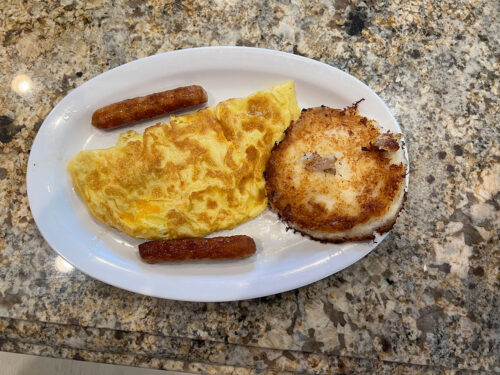 Breakfast with omelette and sausages
