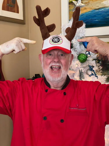 Philip wearing a reindeer antler hat for Butzen's Christmas Delivery